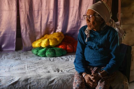 Seti Maya Lama sits looking sombre in her home