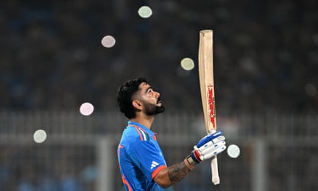 India's Virat Kohli celebrates after scoring a century.