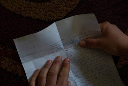 Rima holds a report from doctor who examined her after the attack by her husband.