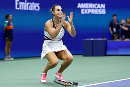 Aryna Sabalenka drops her racket in delight after winning the final.