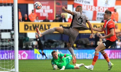 Tottenham Hotspur's Richarlison (left) shins the ball wide at Luton Town.