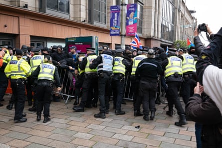 Police hold back anti-immigration protesters in Glasgow