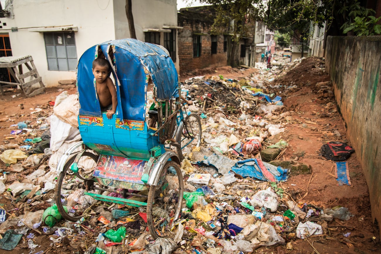 A rubbish-strewn street in Dhaka