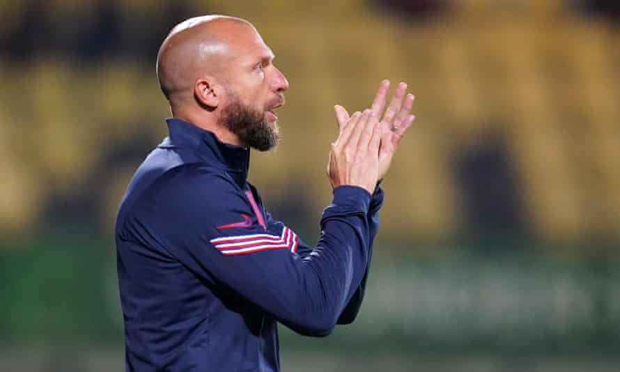 Ian Foster applauds on the sidelines