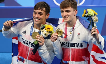 Tom Daley and Matty Lee with their gold medals after a day of high drama at the Tokyo Aquatics Centre.