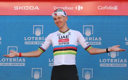 Tadej Pogacar celebrates on the podium in Andorra la Vella