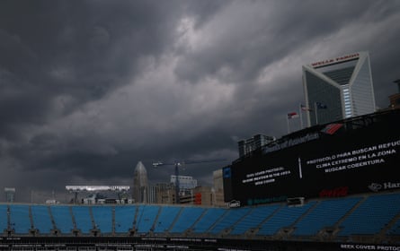 Storm clouds over Bank of America stadium after referee Slavko Vincic signals a weather delay.
