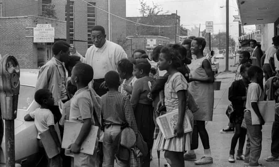Civil rights leader Charles Evers meets with children in Jackson, Mississippi.