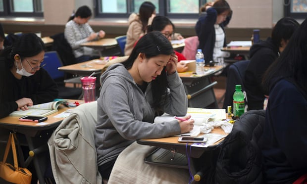 Students sit exams at a high school in Seoul. Government guidelines say that if men spend a lot of money on dates it is ‘natural’ for them to want to be compensated.