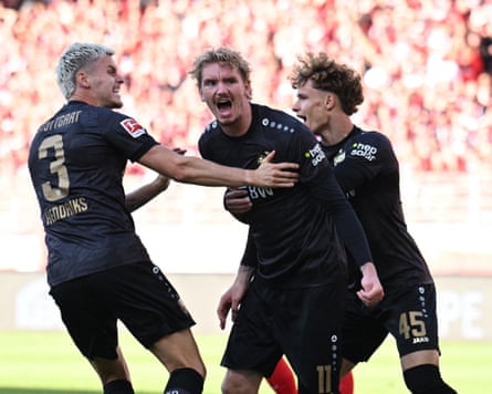 Nick Woltemade celebrates scoring a goal for Stuttgart