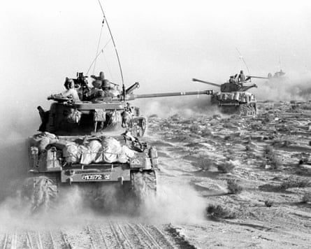 tanks advance over sand