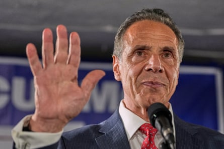 Andrew Cuomo holds up his hand