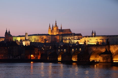 Prague Castle and Charles Bridge at sunset.
