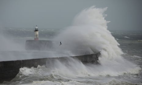 Waves crash against the harbour wall in Newhaven, England. 