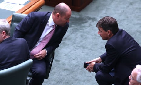 Treasurer Josh Frydenberg (left) talks to the energy minister Angus Taylor in the House of Representatives on Tuesday.