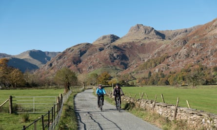 A couple cycling in the Langdale Valley