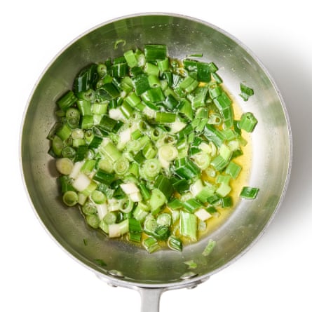 05a Felicity Cloake’s Asparagus Soup. Spring onions bit. Trim the whiskery root ends and dry tops off the spring onions, and roughly chop the rest, both green and white parts. Melt the butter in a medium pan on a medium-low heat then briefly soften the sliced spring onions.