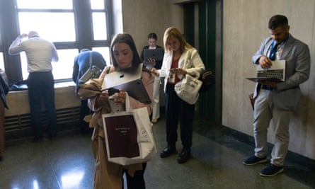 Journalists file stories in a hallway at Manhattan criminal court after a jury found Trump guilty, on 30 May.