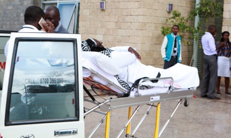 An injured student leaves Strathmore University after the drill