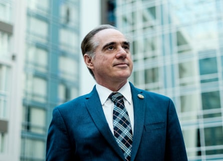 a in suit man looking up