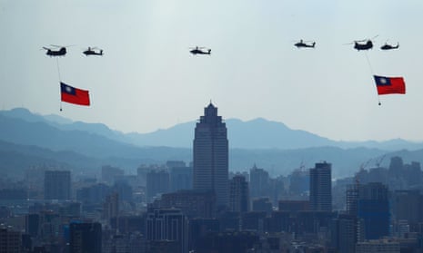 Taiwanese military helicopters rehearsing for the island’s national day celebrations near Taipei, amid growing military threats from China.