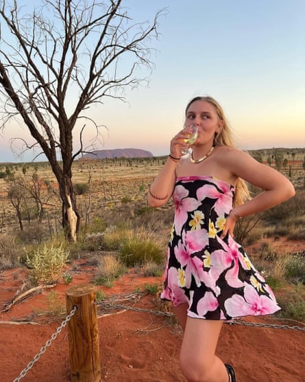 Young women in front of Uluru
