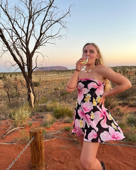 Young women in front of Uluru 