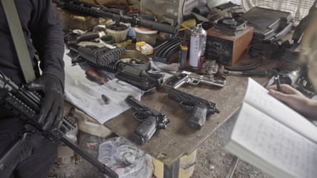 Weapons belonging to the Sinaloa Cartel are repaired in a workshop located in the countryside near Culiacán (Sinaloa, Mexico). Heckler &amp; Koch (Germany), Beretta (Italy) and Llama (Spain) pistols sit on the work table.