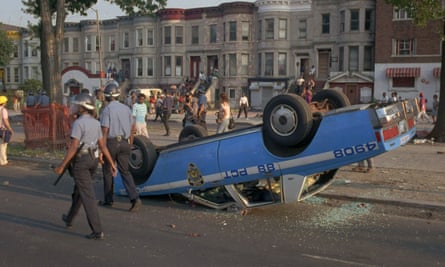 A police car overturned by rioters during the Crown Heights unrest of August 1991.