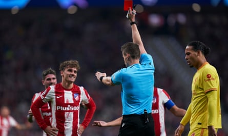 Antoine Griezmann receives a red card for his dangerous challenge on Roberto Firmino