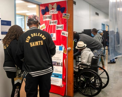 People wait to cast their ballot for the presidential election as early voting begins in New Orleans, Louisiana, on 16 October 2020.