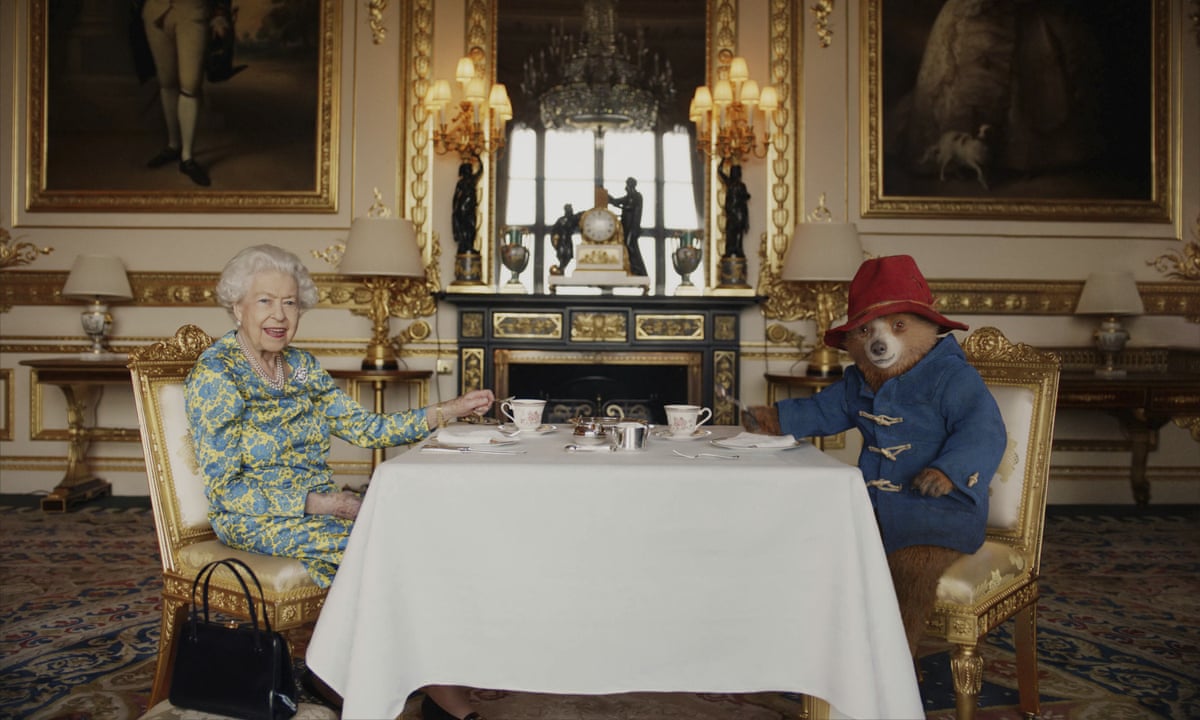 Paddington Bear takes tea – and marmalade – with Queen in jubilee video | Queen's platinum jubilee | The Guardian
