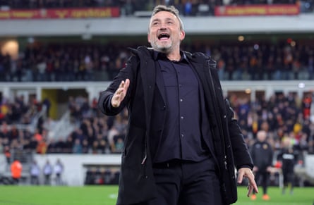 Lens coach Franck Haise celebrates after the game