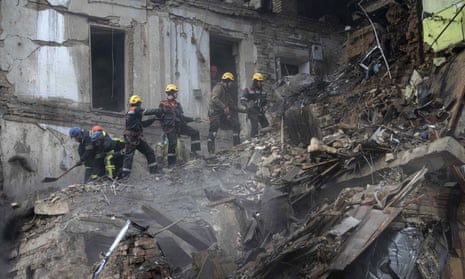 Ukrainian emergency workers clear rubble at a building destroyed in a Russian missile attack in Kryvyi Rih, central Ukraine, last week