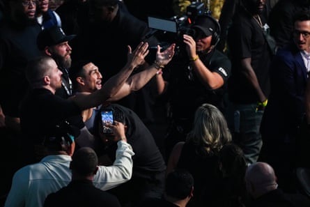 Teófimo López is restrained by security after Ryan GarciaâÂÂs victory over Conor Benn.