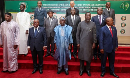 Ecowas leaders, all men, pose on red-carpeted steps for a photo