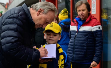 Neil Warnock signs an autograph