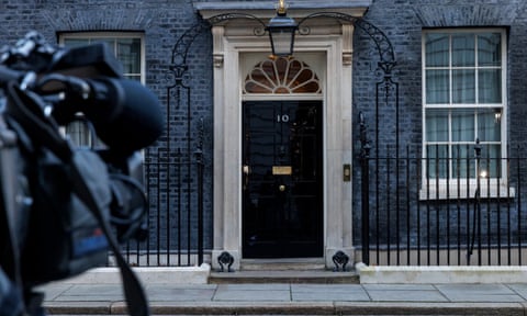A TV camera points towards 10 Downing Street