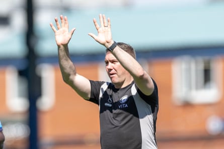 Dave Challinor waves to the Stockport fans after their game against Peterborough in April