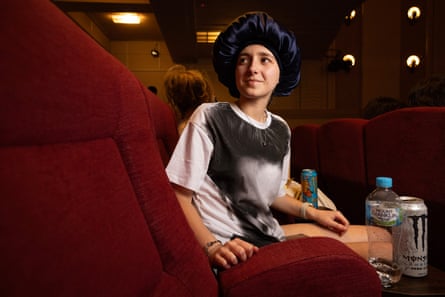 Bessie Habbal wears an Edward Cullen shirt and a hair bonnet for her curls.