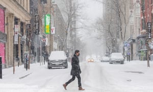A man walks along Ste-Catherine Street in Montreal, on 2 January.
