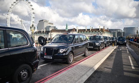 London taxis lined up on Westminster Bridge 