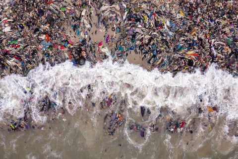 Discarded fast-fashion waste washed up on the coast of Jamestown in Accra, Ghana