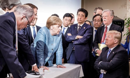 Angela Merkel speaks to Donald Trump at the G7 summit in Canada in June.
