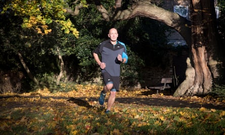 Phil Daoust running in a park in November 2017