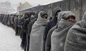 People wait for food in Belgrade, Serbia, 2017.