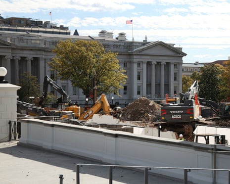 Excavators work to clear debris after the East Wing was demolished earlier this week.