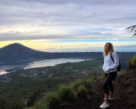 Emily Bratt, pictured climbing a volcano in Bali for sunrise