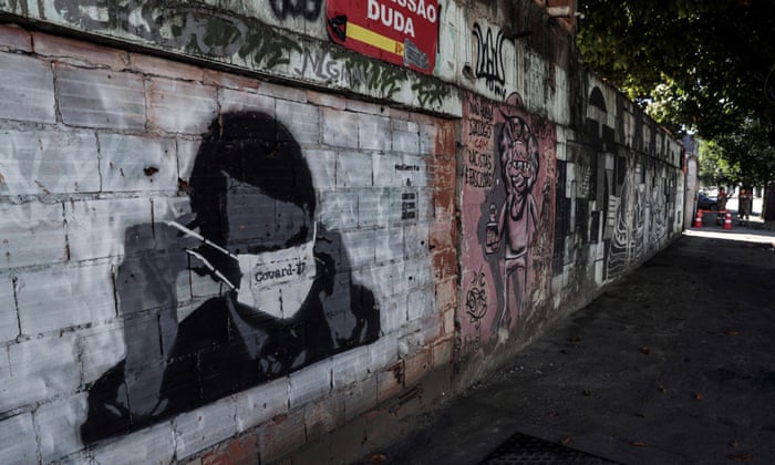 View of a graffiti that shows the president of Brazil while putting on a face mask with the inscription ‘Covard-17’, in criticism of his handling of the Covid-19 pandemic and in reference to the number he used during the presidential campaign, in Rio de Janeiro, Brazil,on 22 June 2020.