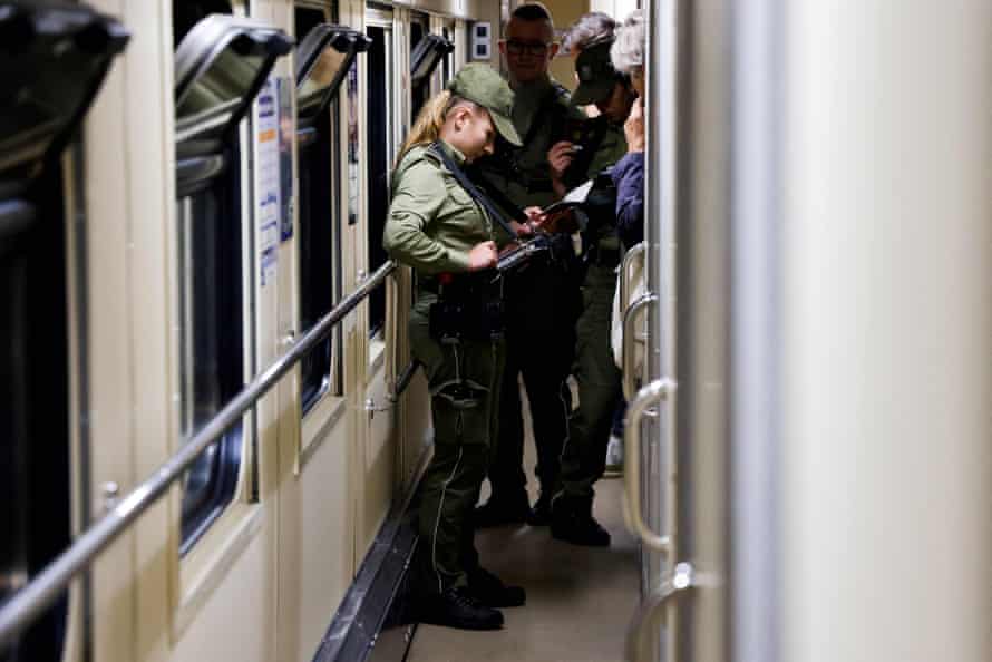 Ukrainian border authorities operate passport control on the train carrying Macron, Scholz and Draghi.